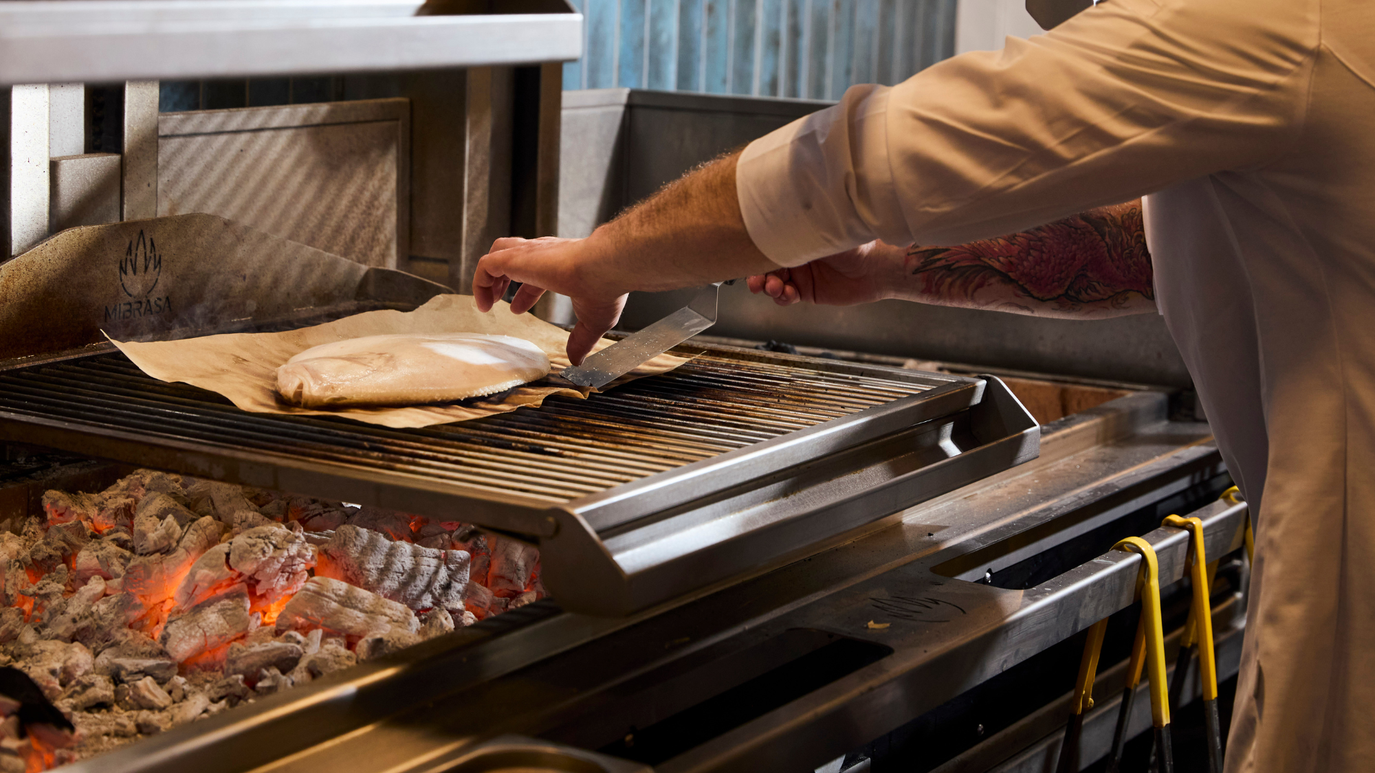 Chef David cooking St Mawes fish on hearth Chef David cooking St Mawes fish on hearth
